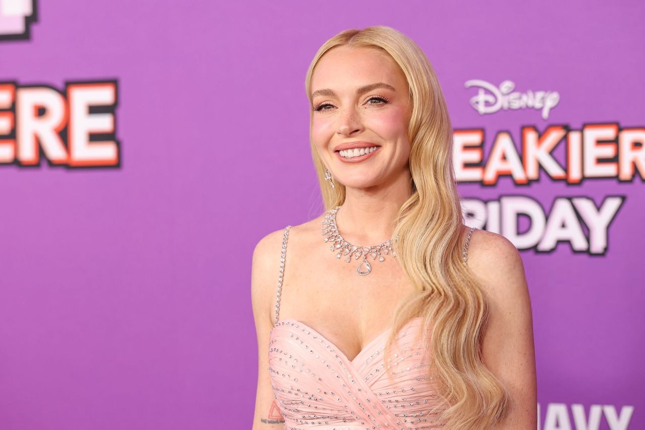 Lindsay Lohan Winks Her Way to the Top with Daring Miu Miu Gown