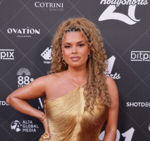 Joy Taylor Debuts Liquid Gold Dress at HollyShorts