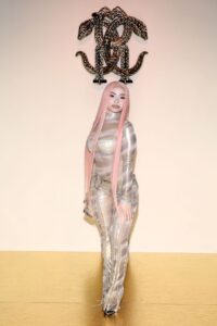 Ice Spice Showcases Gilded Sheer Catsuit at Roberto Cavalli Show