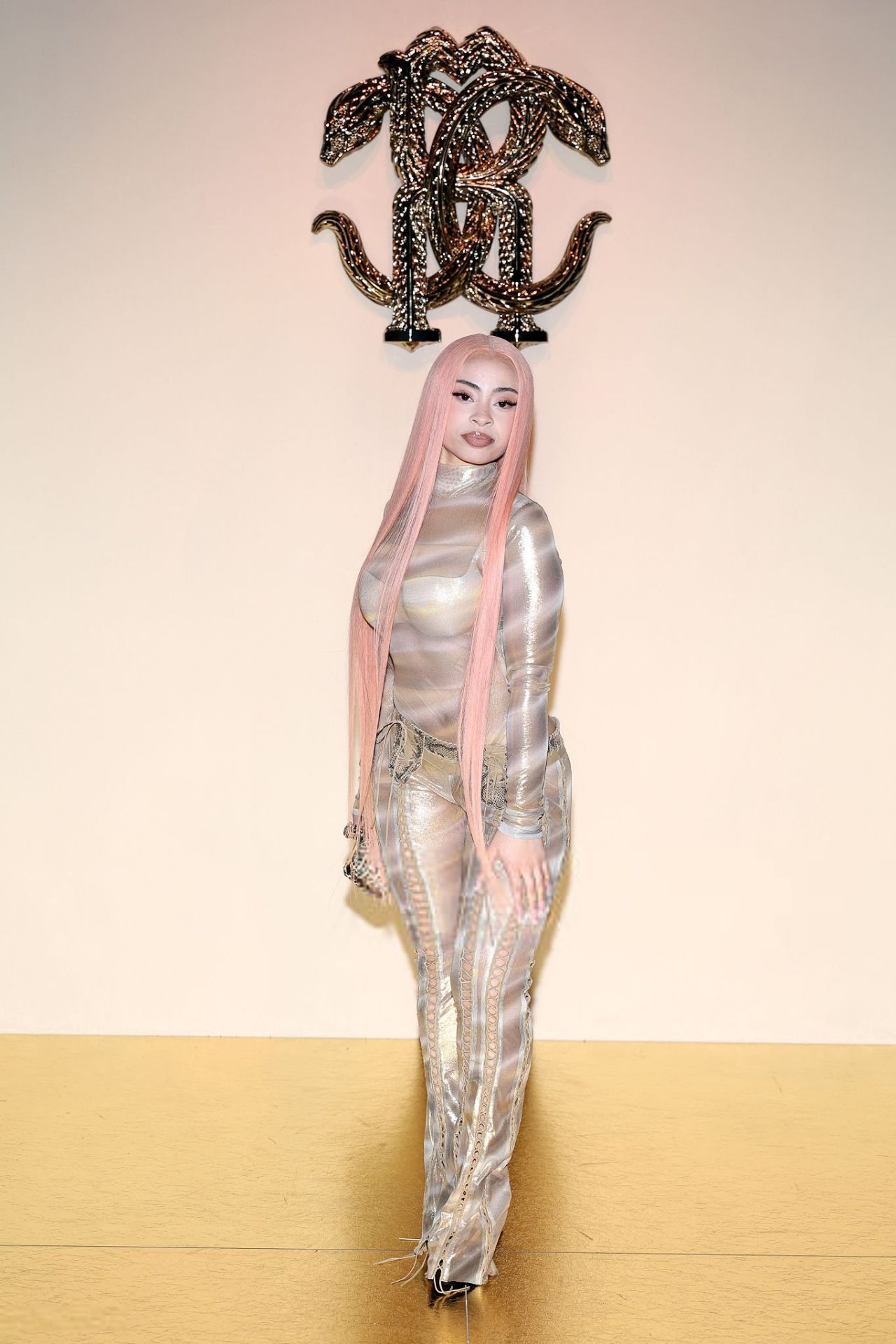 Ice Spice Showcases Gilded Sheer Catsuit at Roberto Cavalli Show