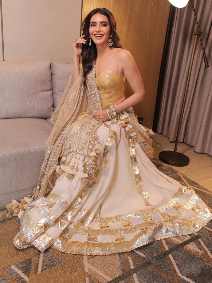 Karishma Tanna Shines in a Regal Golden Ensemble Karishma Tanna Shines in a Regal Golden Ensemble.