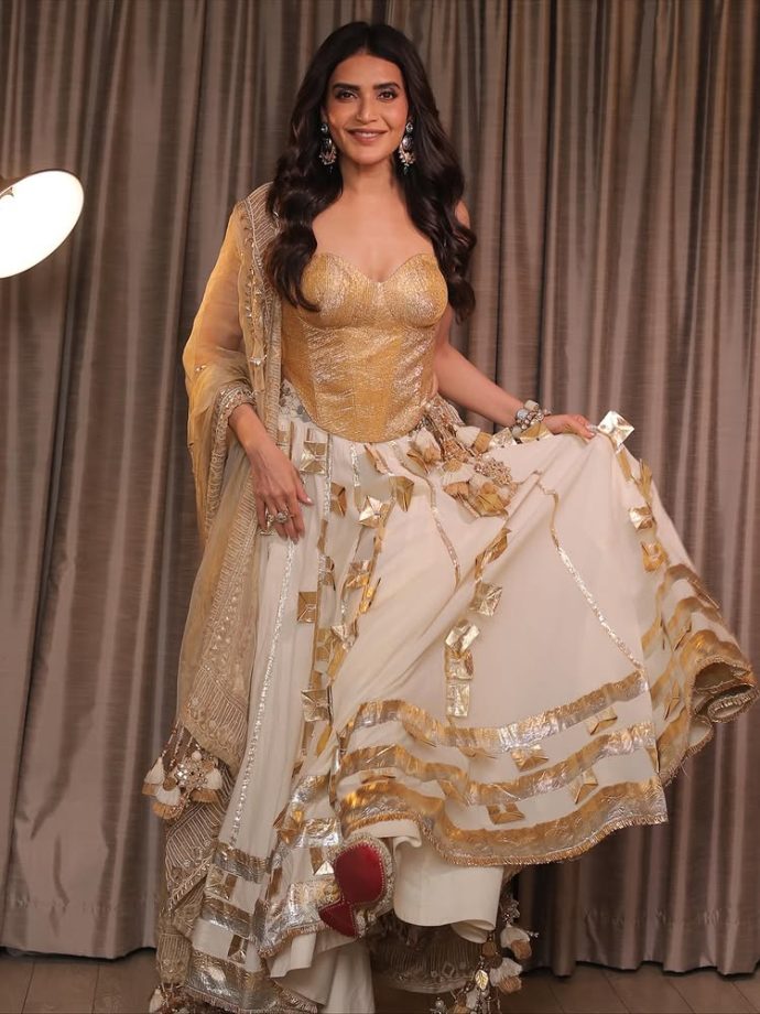 Karishma Tanna Shines in a Regal Golden Ensemble Karishma Tanna Shines in a Regal Golden Ensemble.