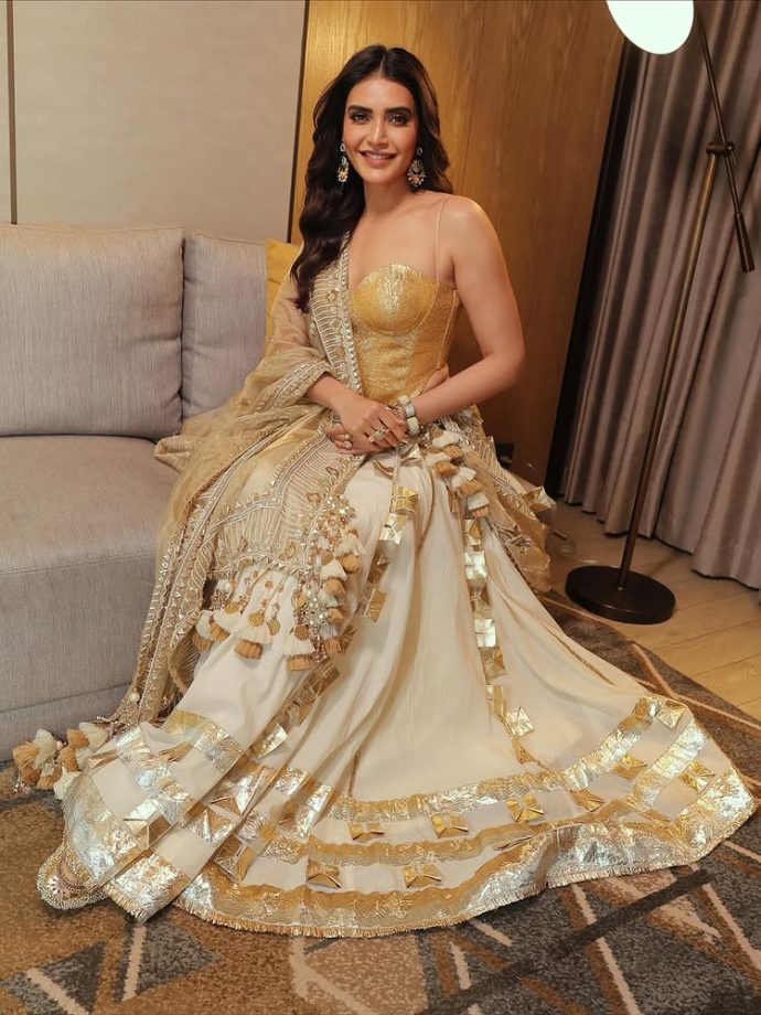 Karishma Tanna Shines in a Regal Golden Ensemble Karishma Tanna Shines in a Regal Golden Ensemble.